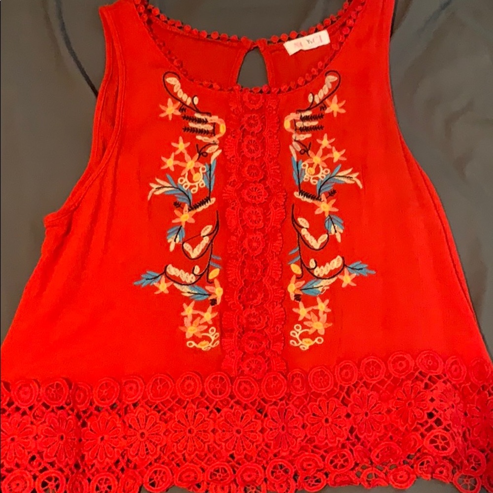 Red blouse with flower detailing